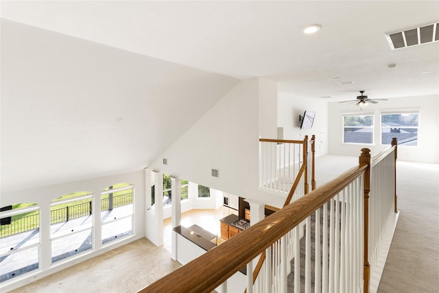 7611 Highmeadow Dr, Houston, TX 77063 - hall featuring an upstairs landing, plenty of natural light, recessed lighting, light colored carpet, and vaulted ceiling