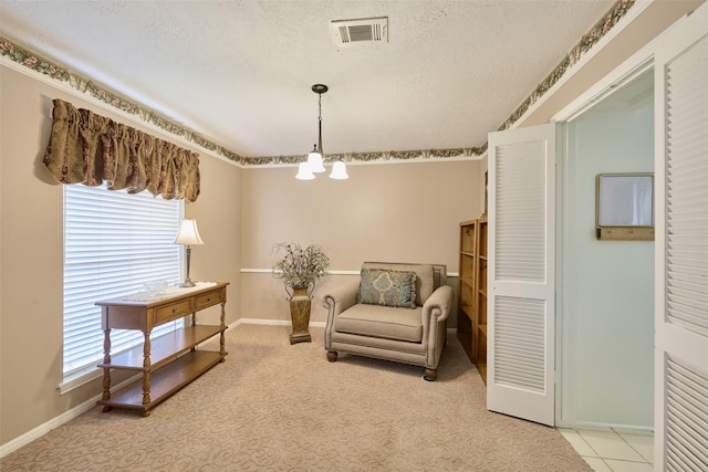 15402 Ripplestream, Houston, TX 77068 - sitting room with a chandelier, plenty of natural light, a textured ceiling, and light colored carpet