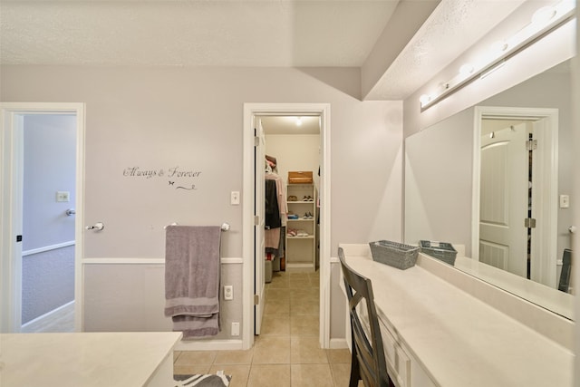 15402 Ripplestream, Houston, TX 77068 - bathroom featuring vanity, tile patterned floors, and a spacious closet