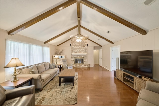 15402 Ripplestream, Houston, TX 77068 - living area with ceiling fan, wood finished floors, and a fireplace
