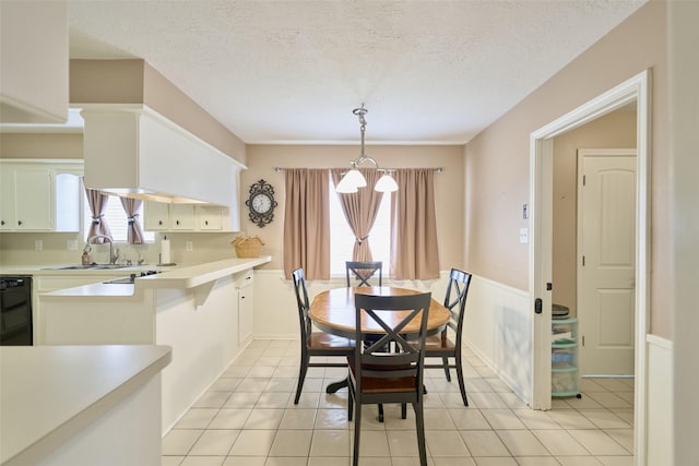 15402 Ripplestream, Houston, TX 77068 - dining room featuring a chandelier, plenty of natural light, light tile patterned floors, and a textured ceiling