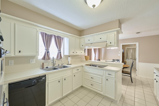 15402 Ripplestream, Houston, TX 77068 - kitchen with black appliances, under cabinet range hood, light tile patterned flooring, light countertops, and a textured ceiling