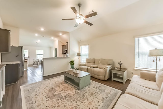 16107 Dockside St, Crosby, TX 77532 - living room with ceiling fan, healthy amount of natural light, vaulted ceiling, and dark wood-style floors