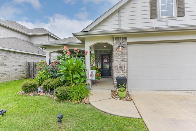 16107 Dockside St, Crosby, TX 77532 - view of exterior entry with a lawn, concrete driveway, and a garage