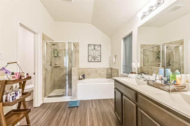 16107 Dockside St, Crosby, TX 77532 - full bath with a bath, a stall shower, double vanity, wood finished floors, and lofted ceiling