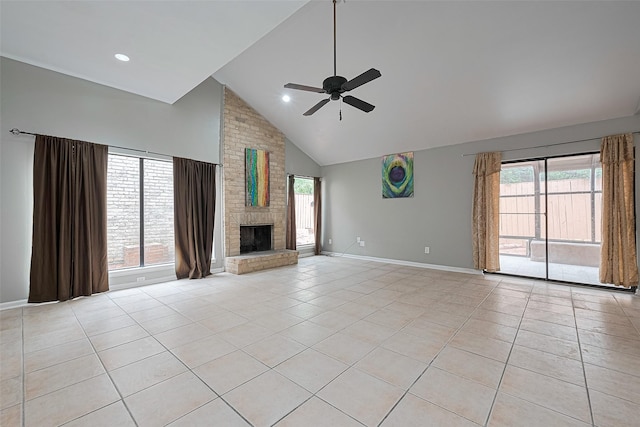 17207 Meadow Butte Dr, Houston, TX 77090 - unfurnished living room with a ceiling fan, light tile patterned floors, high vaulted ceiling, and a fireplace