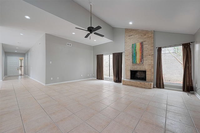 17207 Meadow Butte Dr, Houston, TX 77090 - unfurnished living room with light tile patterned floors, a brick fireplace, a ceiling fan, healthy amount of natural light, and recessed lighting