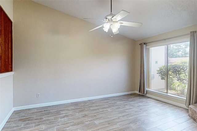 7840 Bateman Ln, Houston, TX 77088 - unfurnished room with vaulted ceiling, ceiling fan, and light wood finished floors