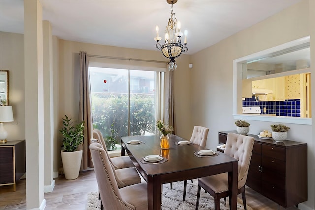 7840 Bateman Ln, Houston, TX 77088 - dining space with light wood-type flooring and a chandelier