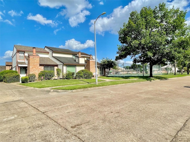 7840 Bateman Ln, Houston, TX 77088 - view of side of home with a yard