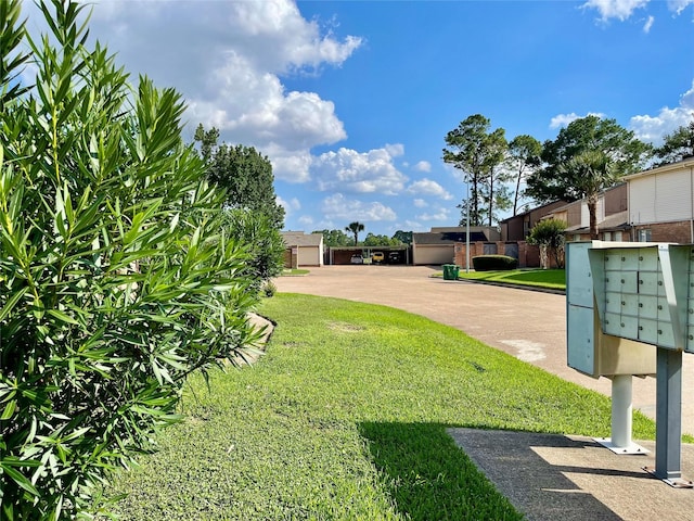 7840 Bateman Ln, Houston, TX 77088 - view of grassy yard with mail area and a residential view