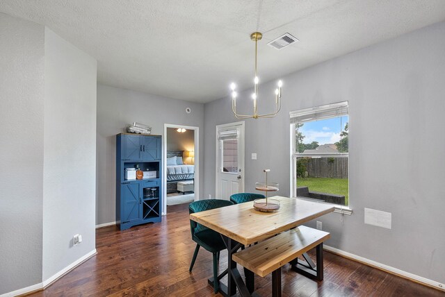 454 Fishhawk Way, Crosby, TX 77532 - dining space featuring dark wood finished floors and a chandelier