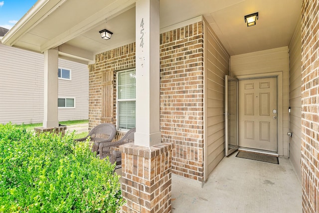 454 Fishhawk Way, Crosby, TX 77532 - doorway to property with brick siding and covered porch
