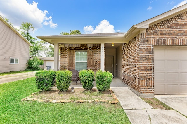 454 Fishhawk Way, Crosby, TX 77532 - property entrance featuring brick siding, an attached garage, and a lawn