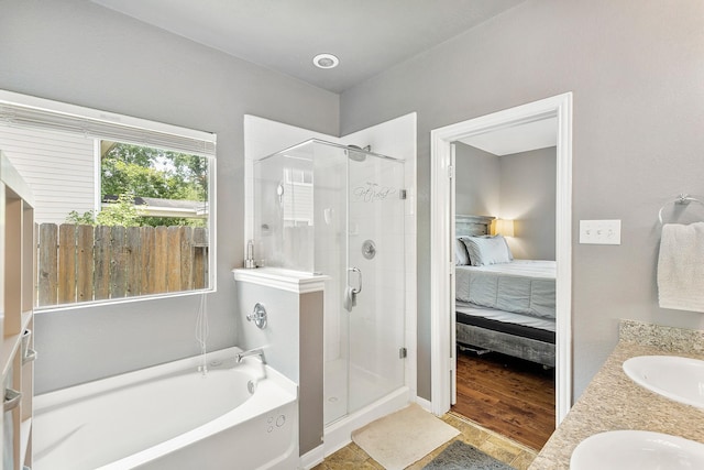 454 Fishhawk Way, Crosby, TX 77532 - bathroom featuring a stall shower, ensuite bath, a bath, and double vanity