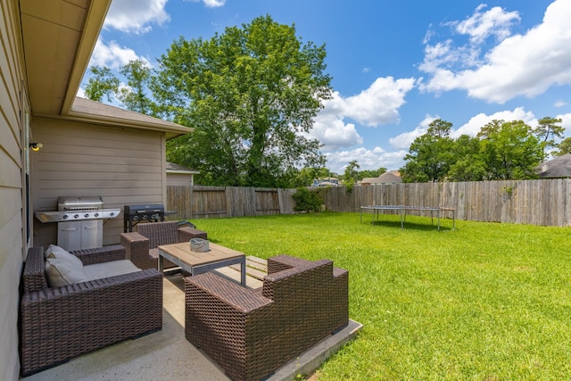 454 Fishhawk Way, Crosby, TX 77532 - fenced backyard featuring an outdoor hangout area and a trampoline