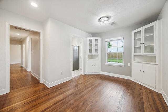 1813 Huge Oaks St, Houston, TX 77055 - unfurnished dining area featuring dark wood-style floors and baseboards