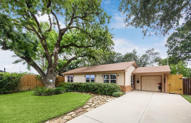1813 Huge Oaks St, Houston, TX 77055 - ranch-style house with an attached garage, brick siding, and driveway