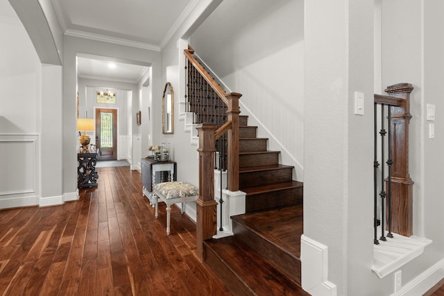 266 Tortoise Creek Pl, The Woodlands, TX 77389 - entryway with dark wood finished floors, crown molding, stairs, and a chandelier