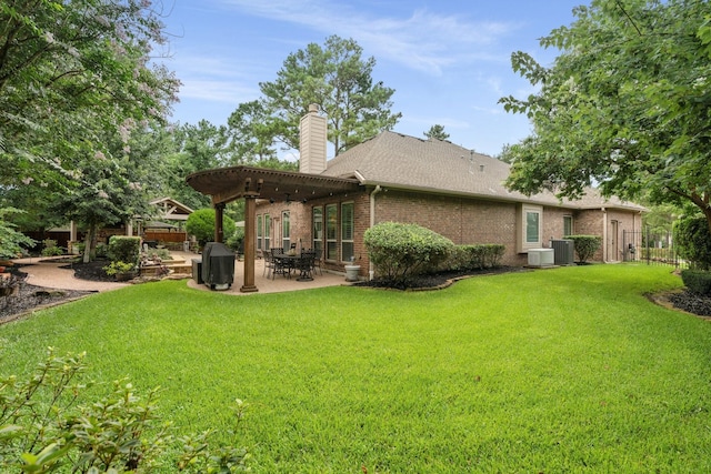 266 Tortoise Creek Pl, The Woodlands, TX 77389 - rear view of property with a pergola, a chimney, a patio, brick siding, and a shingled roof