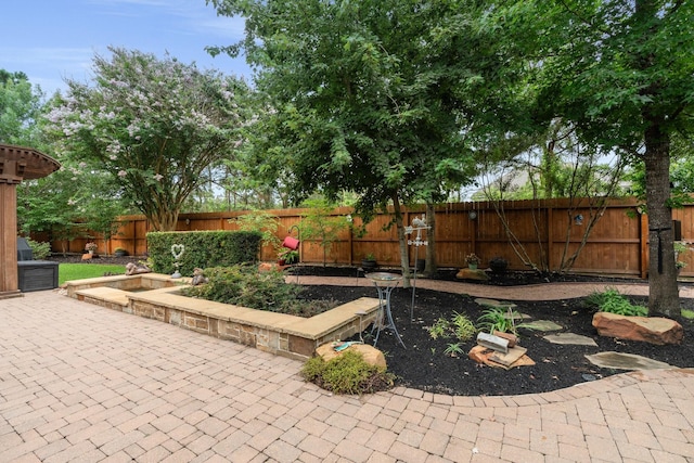 266 Tortoise Creek Pl, The Woodlands, TX 77389 - fenced backyard with a patio