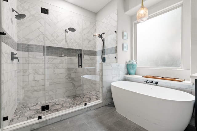 266 Tortoise Creek Pl, The Woodlands, TX 77389 - full bathroom with a freestanding bath, a shower stall, marble look tile flooring, and tile walls