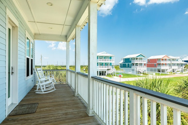 3806 Abalone Rd, Galveston, TX 77554 - wooden porch with a residential view