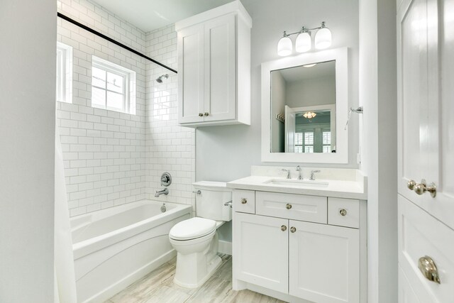 3806 Abalone Rd, Galveston, TX 77554 - bathroom with vanity, tub / shower combination, and wood finished floors