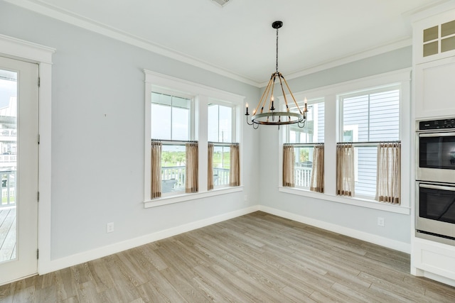 3806 Abalone Rd, Galveston, TX 77554 - unfurnished dining area featuring a chandelier, light wood finished floors, and crown molding