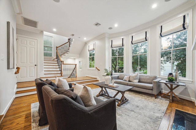 5200 Jackson St, Houston, TX 77004 - living area with wood finished floors, crown molding, stairway, and recessed lighting
