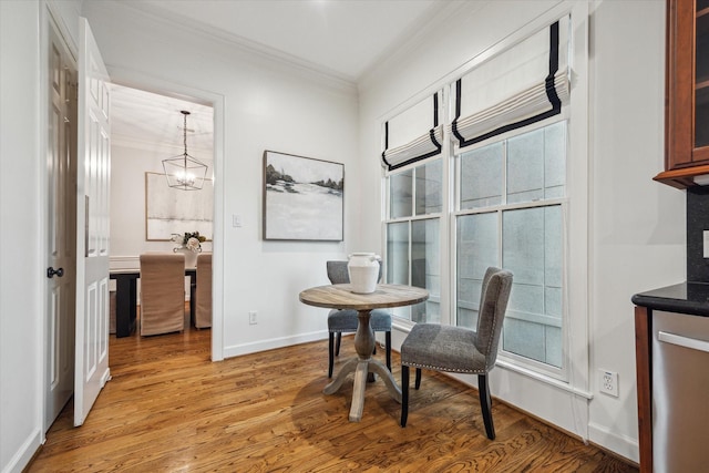 5200 Jackson St, Houston, TX 77004 - dining area with ornamental molding, light wood finished floors, and a chandelier