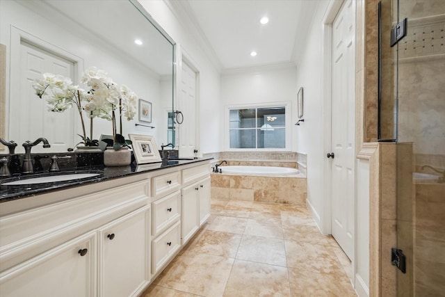 5200 Jackson St, Houston, TX 77004 - full bathroom with double vanity, crown molding, a garden tub, a shower stall, and recessed lighting