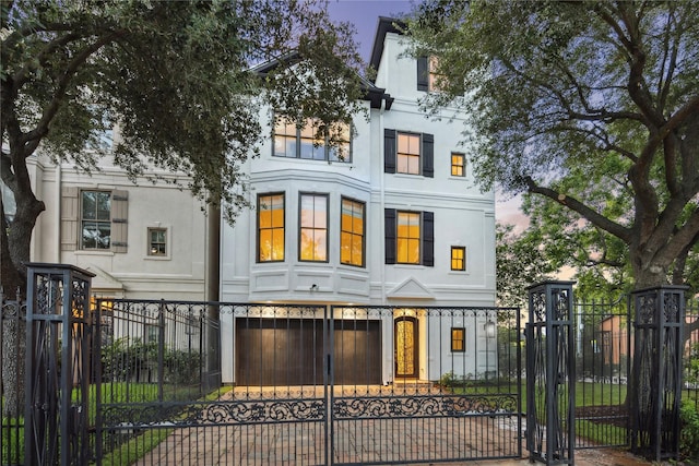 5200 Jackson St, Houston, TX 77004 - view of front of house with a fenced front yard, a gate, and stucco siding