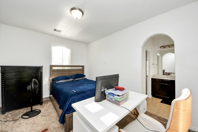 9003 Alps Peak Ct, Richmond, TX 77407 - bedroom with arched walkways and ensuite bath