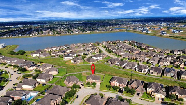 9003 Alps Peak Ct, Richmond, TX 77407 - aerial overview of property's location with nearby suburban area and a nearby body of water