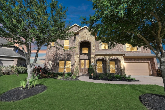 9003 Alps Peak Ct, Richmond, TX 77407 - view of front of home featuring brick siding, driveway, and a front lawn
