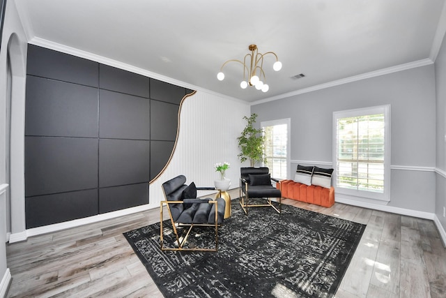 9003 Alps Peak Ct, Richmond, TX 77407 - living area featuring crown molding, light wood-style flooring, and a chandelier
