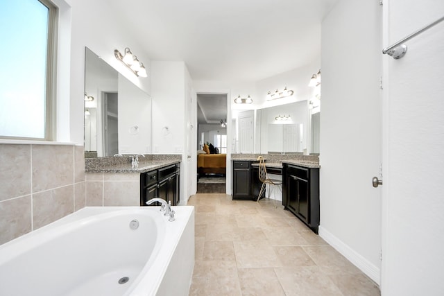 9003 Alps Peak Ct, Richmond, TX 77407 - ensuite bathroom featuring vanity and a bath