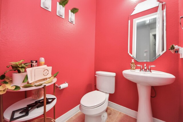 9003 Alps Peak Ct, Richmond, TX 77407 - half bath with toilet and tile patterned flooring