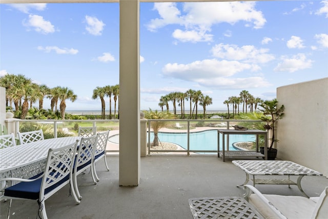 10327 Termini San Luis Pass Rd Unit 206, Galveston, TX 77554 - view of patio featuring a water view and an outdoor pool