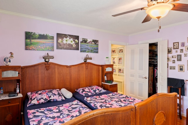 5022 Briarbend Dr, Houston, TX 77035 - bedroom featuring ornamental molding, a ceiling fan, and a closet