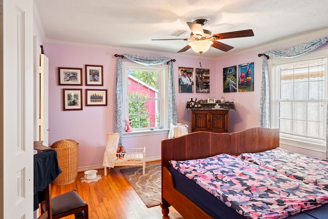 5022 Briarbend Dr, Houston, TX 77035 - bedroom with wood-type flooring, ornamental molding, and a ceiling fan