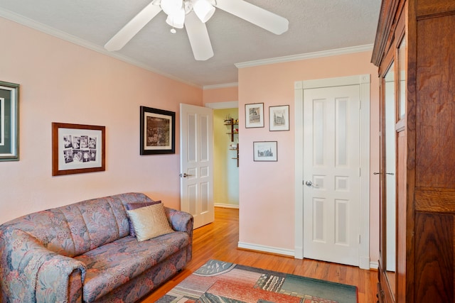 5022 Briarbend Dr, Houston, TX 77035 - living room featuring light wood finished floors, ornamental molding, and a ceiling fan