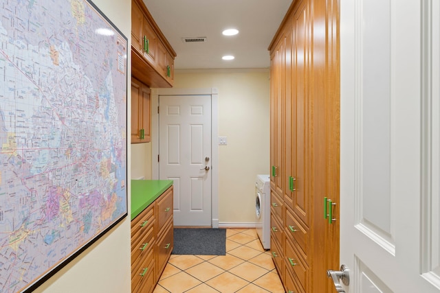 5022 Briarbend Dr, Houston, TX 77035 - doorway to outside with washer / clothes dryer, light tile patterned floors, and recessed lighting
