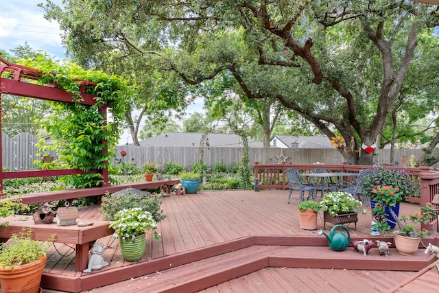 5022 Briarbend Dr, Houston, TX 77035 - wooden deck featuring a fenced backyard and outdoor dining space