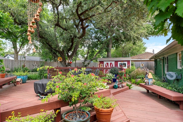 5022 Briarbend Dr, Houston, TX 77035 - wooden deck with a fenced backyard, a storage shed, and a grill