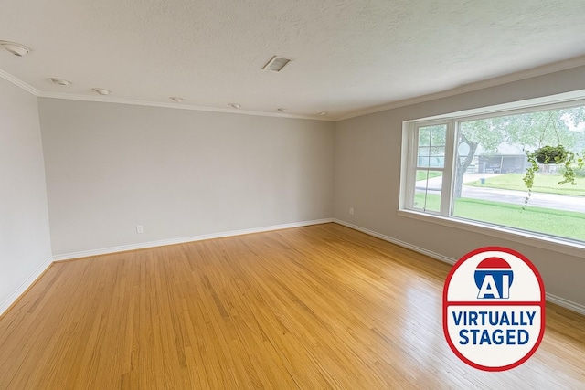 5022 Briarbend Dr, Houston, TX 77035 - unfurnished room featuring light wood-style floors, ornamental molding, and a textured ceiling