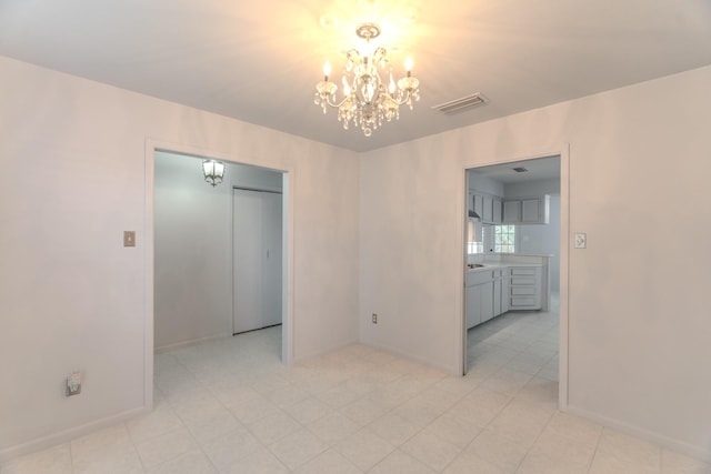 3906 Antoine Dr, Houston, TX 77092 - spare room with a chandelier and baseboards