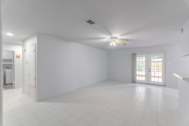 3906 Antoine Dr, Houston, TX 77092 - unfurnished room with ceiling fan, french doors, washer / dryer, and light tile patterned floors