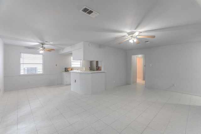 3906 Antoine Dr, Houston, TX 77092 - unfurnished living room featuring a ceiling fan and baseboards